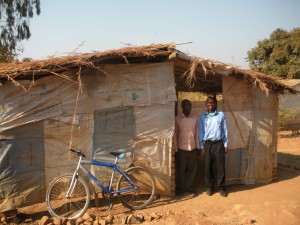 Pastor Arnold in front of his church in Malawi