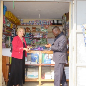 Mary Dee, Frank -- buying flipcharts in Kisoro