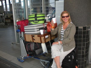 Aimee with luggage including a water cart