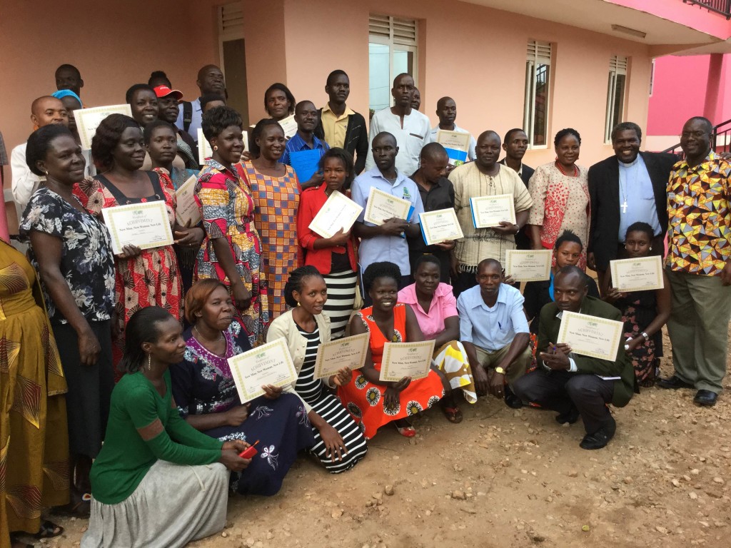 Seminar graduates proudly display their certificates.