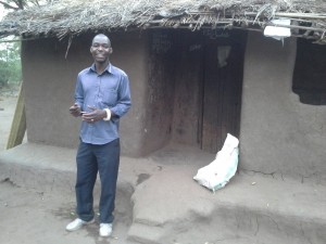 Arnold in front of his rustic accommodations. 