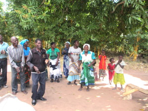 Singing and dancing greet the Empower team.