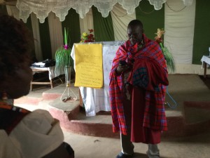 Frank receives a Masai dress as a gift.