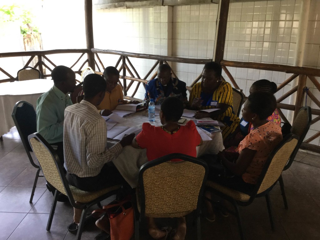 A group studies together at the Tanzania seminar.