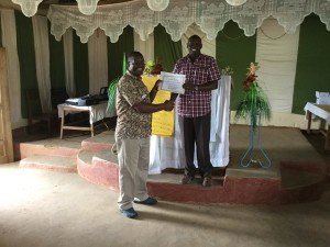 Pastor David receives his certificate.